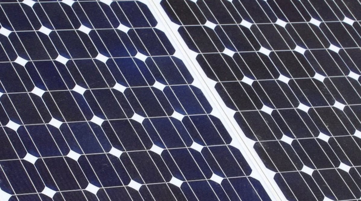 Close-up of tempered glass over solar cells at an angle